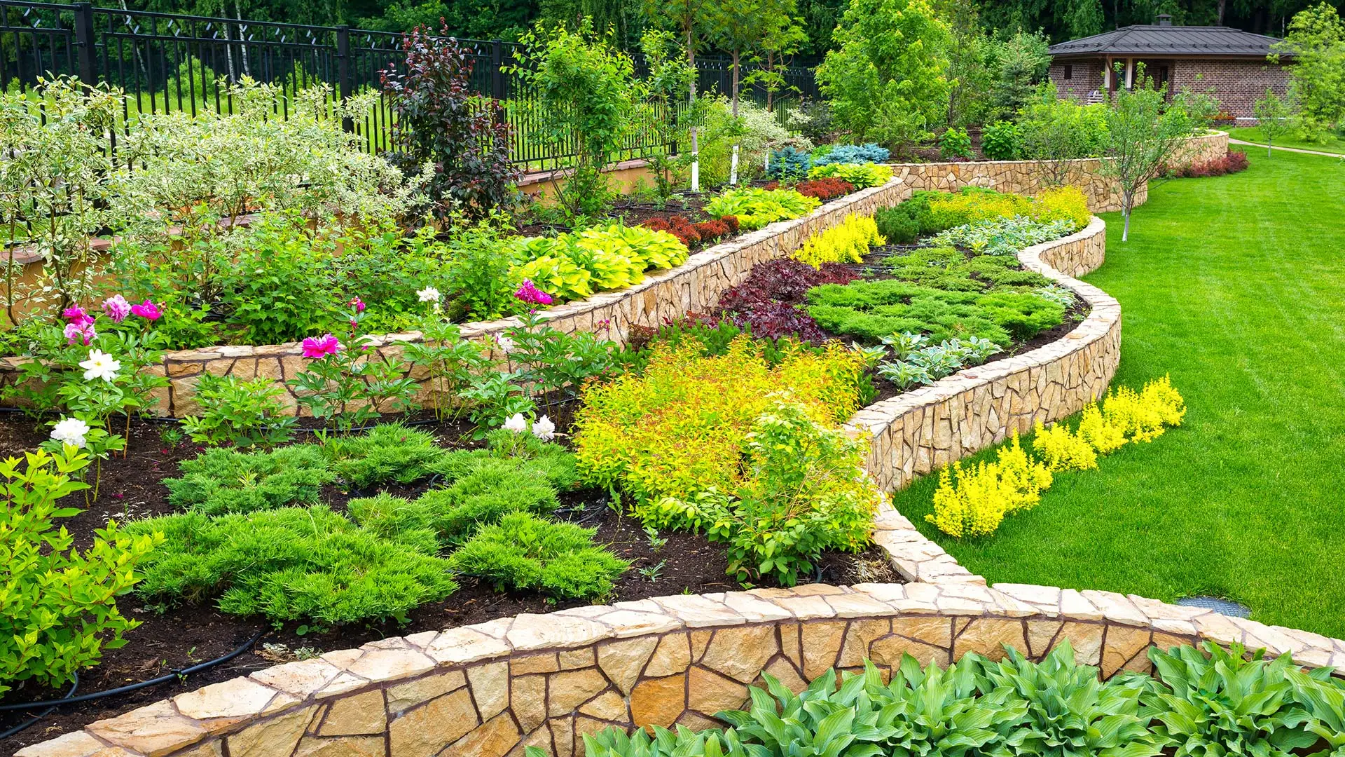 A backyard with lard raised landscape beds in Cumberland, IN. 