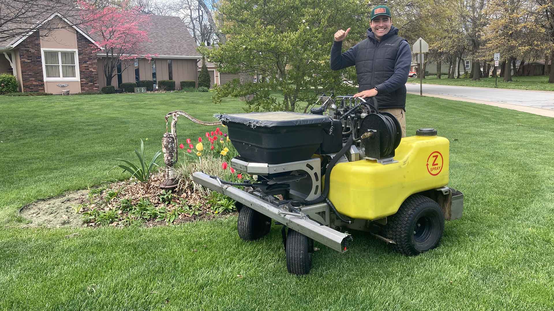 Lawn care equipment in use at a home near Kansas City, KS.