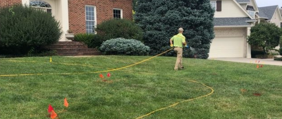 Indiana's Green Again professional applying pre-emergent weed control to lawn in Fishers, IN.